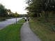 Well-maintained sidewalk perfect for strolling, walking or jogging in the Seven Oaks community, surrounded by beautiful landscaping at 4116 Knollpoint Dr, Wesley Chapel, FL 33544