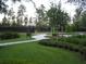 Community tennis courts with a smooth walkway and ample green space around them at 4116 Knollpoint Dr, Wesley Chapel, FL 33544