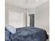 A bedroom featuring neutral paint, a double closet, and a ceiling fan at 4901 Windingbrook Trl, Wesley Chapel, FL 33544