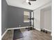 A versatile bedroom featuring wood floors, and exercise equipment at 4901 Windingbrook Trl, Wesley Chapel, FL 33544