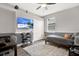 Bedroom with hard wood floors, a double closet, and flat screen tv at 4901 Windingbrook Trl, Wesley Chapel, FL 33544