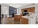 Kitchen featuring light wood cabinets, stainless steel appliances, and tile floors at 4901 Windingbrook Trl, Wesley Chapel, FL 33544