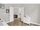 Bright home office with wood floors and a view to the adjacent dining room at 4901 Windingbrook Trl, Wesley Chapel, FL 33544
