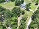 Scenic aerial shot of a stunning home surrounded by mature trees and a well-kept lawn at 5007 Booth Rd, Plant City, FL 33565