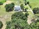 Beautiful home with an expansive, green lawn and mature trees providing shade and privacy at 5007 Booth Rd, Plant City, FL 33565