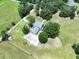 Aerial view of a home with lush trees and surrounded by greenery and rural landscape at 5007 Booth Rd, Plant City, FL 33565