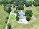 Aerial view of a house nestled among trees surrounded by expansive, open landscapes at 5007 Booth Rd, Plant City, FL 33565