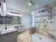 Luxurious bathroom featuring a walk-in shower, dual sinks and modern fixtures at 5007 Booth Rd, Plant City, FL 33565