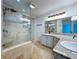 Updated bathroom with a glass walk-in shower and granite countertops at 5007 Booth Rd, Plant City, FL 33565