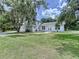 Traditional two-story home with well-manicured lawn, attached garage, and inviting entryway at 5007 Booth Rd, Plant City, FL 33565