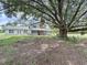 Charming two-story home with a welcoming front porch and mature shade tree at 5007 Booth Rd, Plant City, FL 33565