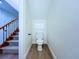 Convenient half bathroom with modern fixtures and wood-look flooring is perfect for guests at 5007 Booth Rd, Plant City, FL 33565
