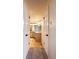 Hallway view into a renovated bathroom with a modern vanity at 5007 Booth Rd, Plant City, FL 33565