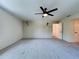 Bright living room with ceiling fan and neutral wall paint at 5007 Booth Rd, Plant City, FL 33565