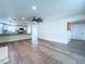 Open-concept living room featuring a ceiling fan, recessed lights, and beautiful wood-look floors at 5007 Booth Rd, Plant City, FL 33565