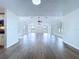 Spacious living room with hardwood floors, natural light and neutral color scheme, ready for personal touches at 5007 Booth Rd, Plant City, FL 33565