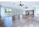 Spacious living room with hardwood floors, high ceilings, recessed lighting, and ample natural light at 5007 Booth Rd, Plant City, FL 33565