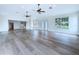 Open-concept living room with hardwood floors and natural light, blending style and comfort at 5007 Booth Rd, Plant City, FL 33565