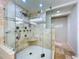 Modern walk-in shower with travertine tile, multiple shower heads, and a built-in bench at 5007 Booth Rd, Plant City, FL 33565