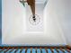 View looking up at a modern chandelier from the staircase at 5007 Booth Rd, Plant City, FL 33565