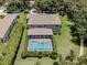 Overhead view of a home with a private screened pool, complemented by a well-maintained lawn and landscaping at 5315 Cedarshake Ln, Valrico, FL 33596