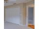 Bedroom view featuring carpet flooring, a ceiling fan, and a door to another room at 5315 Cedarshake Ln, Valrico, FL 33596