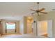 Large bedroom with a ceiling fan and natural lighting coming from the window at 5315 Cedarshake Ln, Valrico, FL 33596