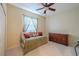 Cozy bedroom with a daybed, a ceiling fan, and a dresser at 5315 Cedarshake Ln, Valrico, FL 33596