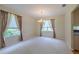 Inviting dining room boasts neutral carpet and ample natural light from large windows, ideal for Gathering gatherings at 5315 Cedarshake Ln, Valrico, FL 33596