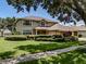 Beautiful two-story home showcasing mature trees, a well-maintained lawn, and inviting curb appeal at 5315 Cedarshake Ln, Valrico, FL 33596