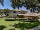 Inviting two-story home with a well-kept lawn, manicured bushes, and a three-car garage at 5315 Cedarshake Ln, Valrico, FL 33596