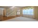 Elegant foyer features neutral carpet, a staircase, and decorative front doors creating a grand entrance at 5315 Cedarshake Ln, Valrico, FL 33596