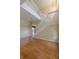 Bright foyer showcases beautiful wood floors, a staircase with white banisters, and neutral-toned walls at 5315 Cedarshake Ln, Valrico, FL 33596