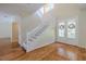 Bright and open foyer showcases a staircase and decorative front doors, creating a welcoming entrance at 5315 Cedarshake Ln, Valrico, FL 33596