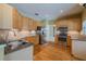 Bright kitchen with stainless steel appliances, granite countertops, and hardwood floors at 5315 Cedarshake Ln, Valrico, FL 33596