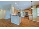 Spacious kitchen featuring stainless steel appliances, hardwood floors, and granite countertops at 5315 Cedarshake Ln, Valrico, FL 33596