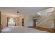 Spacious living room with neutral carpet and large windows flows seamlessly into the foyer and staircase at 5315 Cedarshake Ln, Valrico, FL 33596