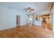 Inviting living area with hardwood floors seamlessly connects to the kitchen, creating an ideal space for gatherings at 5315 Cedarshake Ln, Valrico, FL 33596