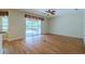 Spacious living room features hardwood floors and sliding glass doors leading to a screened lanai and private pool at 5315 Cedarshake Ln, Valrico, FL 33596