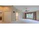 Comfortable main bedroom with a ceiling fan, ensuite bathroom, and walk-in closets for ample storage at 5315 Cedarshake Ln, Valrico, FL 33596