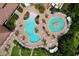 Stunning aerial view of the community pool with ample seating, lush landscaping, and resort-style amenities at 5663 Sunset Falls Dr, Apollo Beach, FL 33572