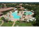 An inviting community pool area featuring multiple pools, seating, and lush landscaping, perfect for relaxation and recreation at 5663 Sunset Falls Dr, Apollo Beach, FL 33572