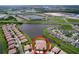 Aerial view of a residential area featuring single-Gathering homes, lush greenery and lakes at 5663 Sunset Falls Dr, Apollo Beach, FL 33572
