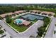 A beautiful community featuring tennis courts, pool, and clubhouse, surrounded by lush landscaping and well-maintained lawns at 5663 Sunset Falls Dr, Apollo Beach, FL 33572