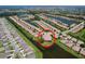 Expansive aerial view of a residential community featuring pond views and multiple single Gathering homes at 5663 Sunset Falls Dr, Apollo Beach, FL 33572
