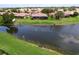 Enjoy the serene water views from your backyard and private screened in lanai at 5663 Sunset Falls Dr, Apollo Beach, FL 33572