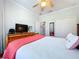 Bright bedroom with TV and large closets for ample storage space at 5663 Sunset Falls Dr, Apollo Beach, FL 33572