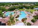 Aerial view of community pools with lush landscaping and ample seating areas at 5663 Sunset Falls Dr, Apollo Beach, FL 33572