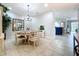Elegant dining room featuring an elegant chandelier, neutral decor and an open-concept design at 5663 Sunset Falls Dr, Apollo Beach, FL 33572