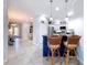 Open-concept kitchen with counter seating, perfect for casual dining and entertaining at 5663 Sunset Falls Dr, Apollo Beach, FL 33572